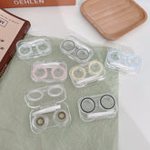 Estuche para lentes de contacto de colores transparente, sencillo y compacto.
