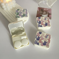 Estuche para lentes de contacto de colores con conejitos coloridos