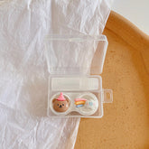 Estuche para lentes de contacto de colores con diseño de animales de dibujos animados