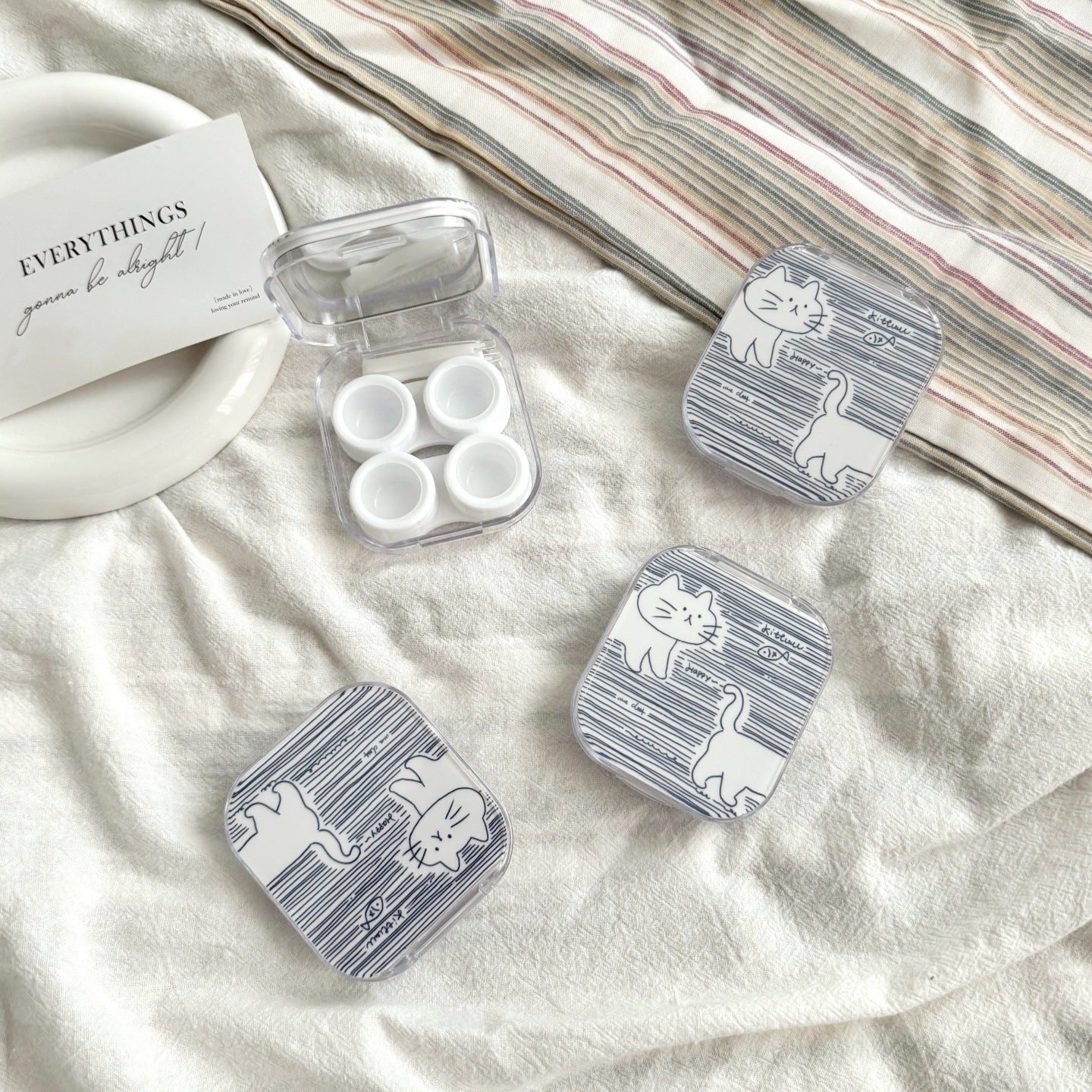 Estuche para lentes de contacto de colores con diseño de pez a rayas de caramelo 