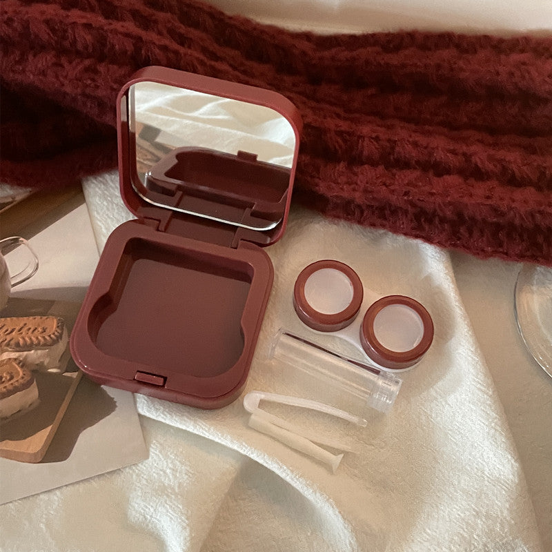 Estuche para lentes de contacto color vino tinto con diseño de nicho INS 